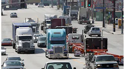 Refrigeratedtransporter 3649 Trucks In Heavy Traffic Getty David Mcnew 0