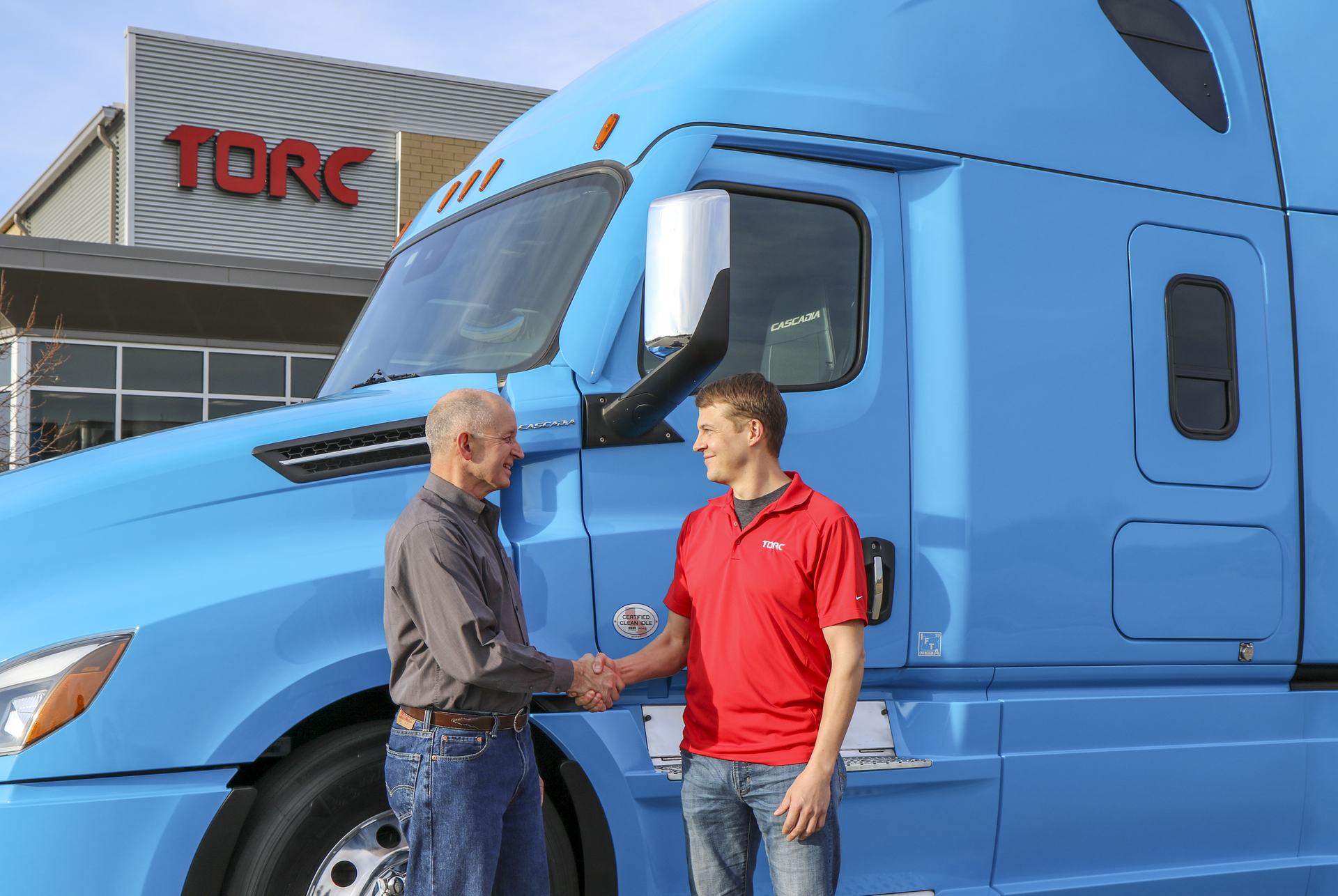 032919 Daimler shakes hands with Torc.jpg