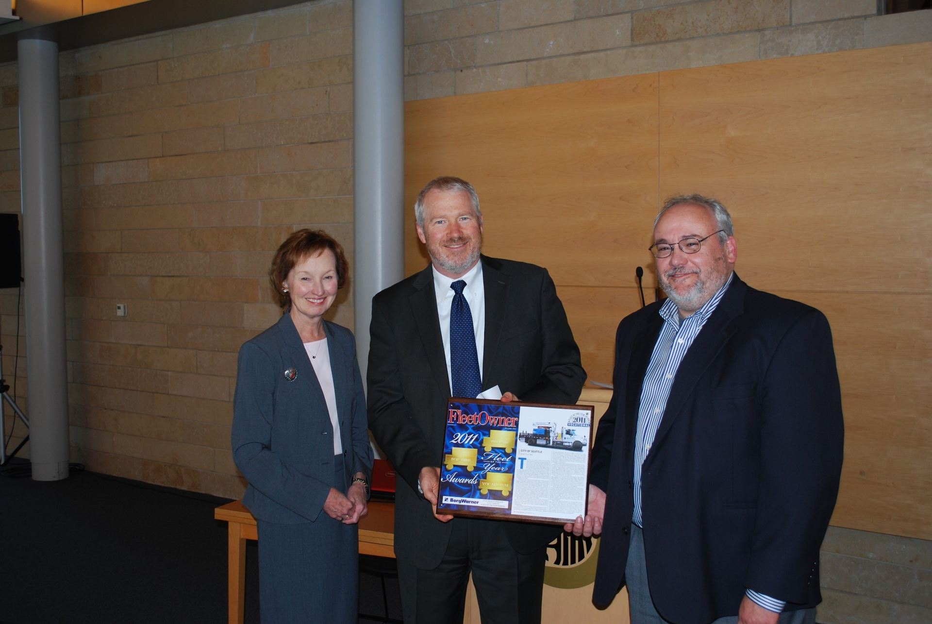 Seattle mayor Mike McGinn center with Fred Podesta director Seattle Department of Finance and Administrative Services right and Wendy Leavitt director of editorial development for Fleet Owner