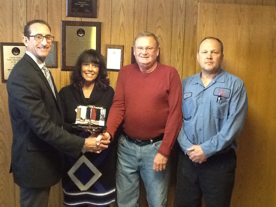 DampS Truck Center was honored as North American Dealer of the Year by Mitsubishi Fuso Truck of America From left Todd Bloom MFTA CEO Michele Royals sales manager Don Schure dealer principal and Don Schure Jr service manager at DampS