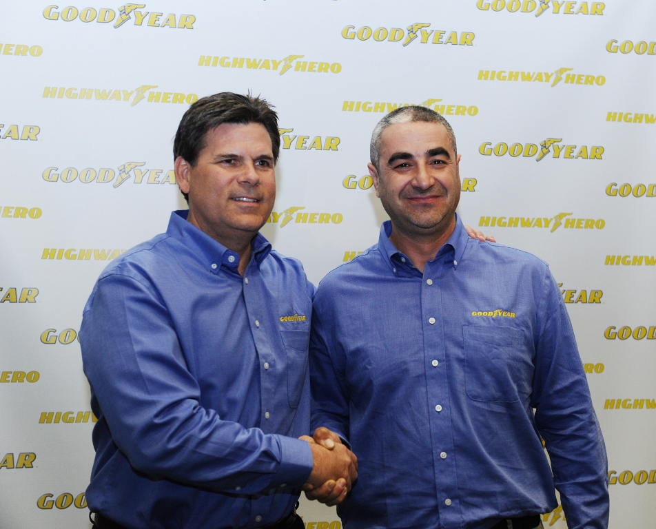 The 31st Goodyear North America Highway Hero Award winner Ivan Vasovic right poses with Gary Medalis marketing director Goodyear Commercial Tire Systems Vasovic rescued another trucker who had fallen from a burning tanker truck that was hanging over the side of a freeway overpass