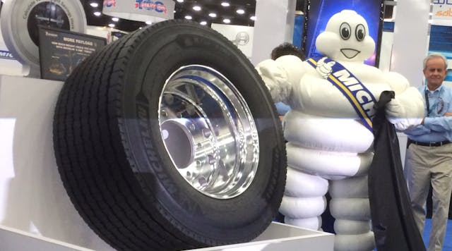 Bibendum-- a.k.a. the Michelin Man-- gleefully unveiling Michelin&apos;s two-millionth X One wide-base single truck tire at the tire maker&apos;s news conferenence at the Mid-America Trucing Show