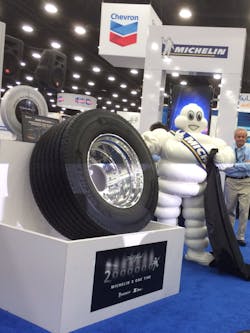 Bibendum aka the Michelin Man gleefully unveiling Michelin39s twomillionth X One widebase single truck tire at the tire maker39s news conferenence at the MidAmerica Trucing Show Bibendum aka the Michelin Man gleefully unveiling Michelin39s twomillionth X One widebase single truck tire at the tire maker39s news conferenence at the MidAmerica Trucing Show