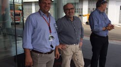 Gian Luca Alberti (left), site manager of Meritor&apos;s Cameri, Italy, axle plant, at start of facilities tour for North American journalists