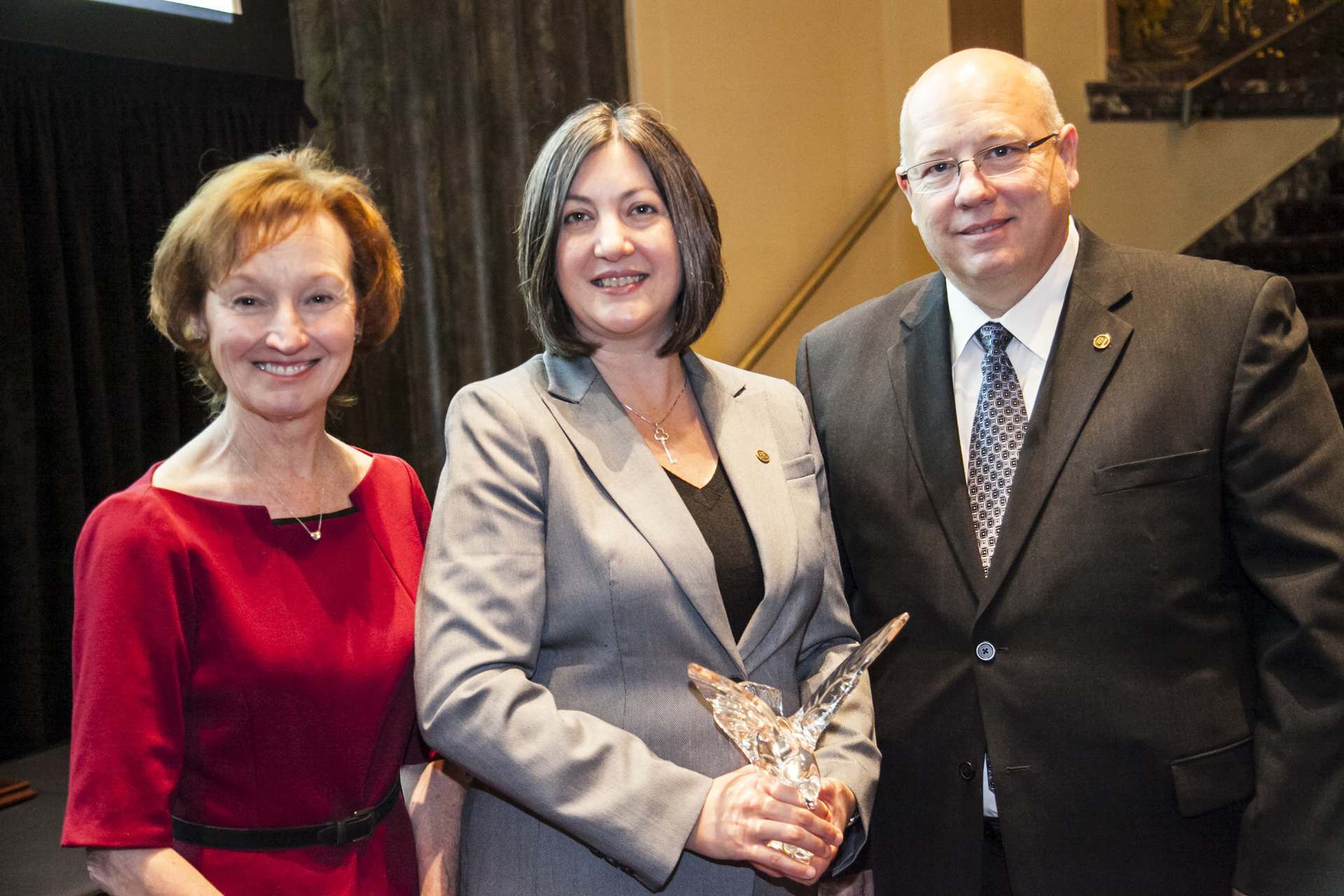 Beth Mars center was presented with the award recognizing the top graduate in the CTP Class of 2014 by Wendy Leavitt Fleet Owner director of editorial development left and Bedford Monday CTP chair NPTC board of directors and general manager of Schwan Food Co