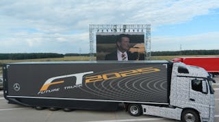 Daimler&apos;s Future Truck 2025, with Dr. Wolfgang Bernhard speaking in the background. Photo by Avery Vise.
