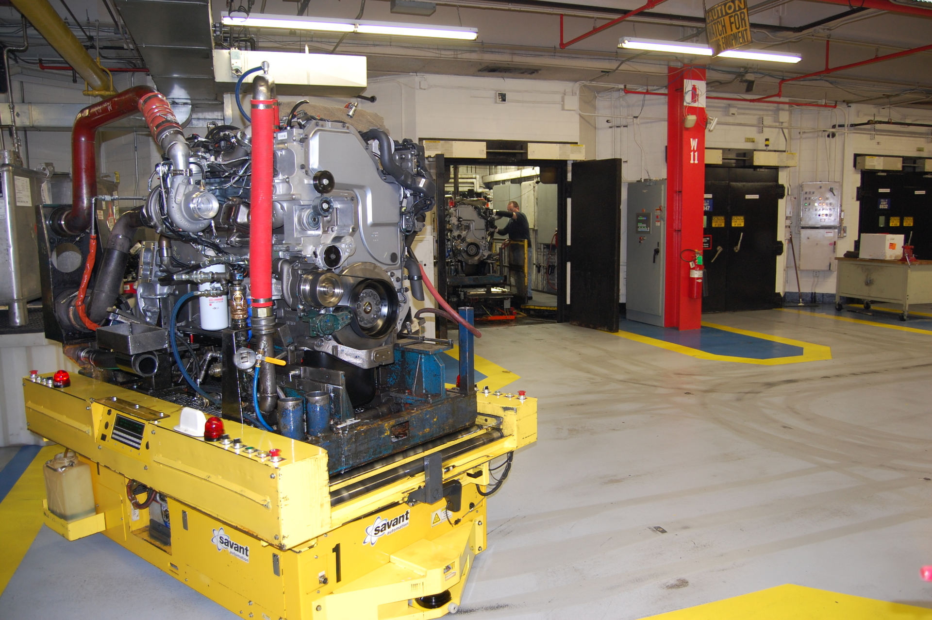 Robots delivering completed engines to the test cells at the Cummins Jamestown NY plant