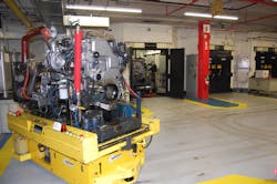 Robots delivering completed engines to the test cells at the Cummins Jamestown NY plant Robots delivering completed engines to the test cells at the Cummins Jamestown NY plant