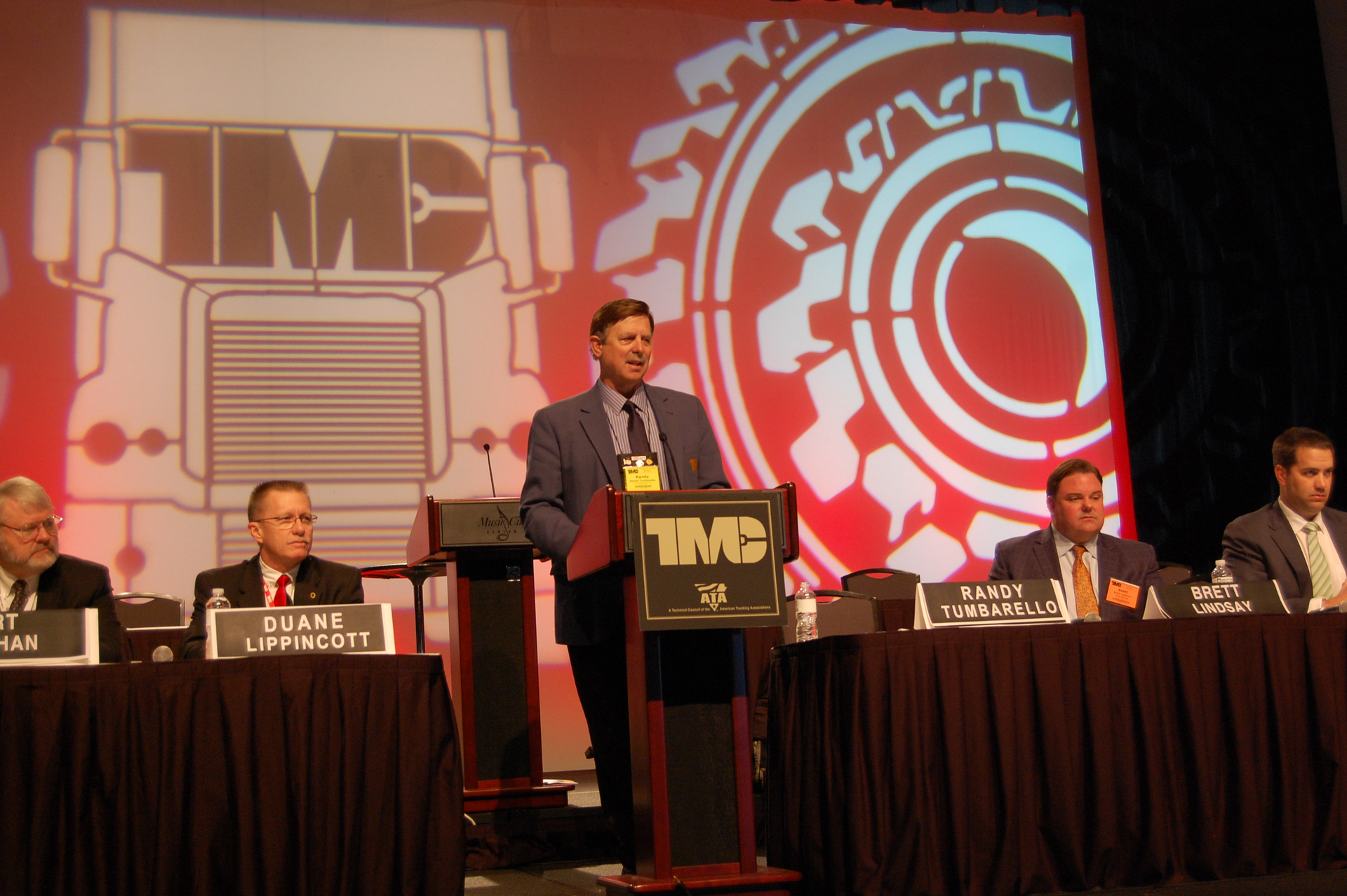 Trimac39s Randy Tumbarello standing guided a wideranging fleet sustainability panel at TMC