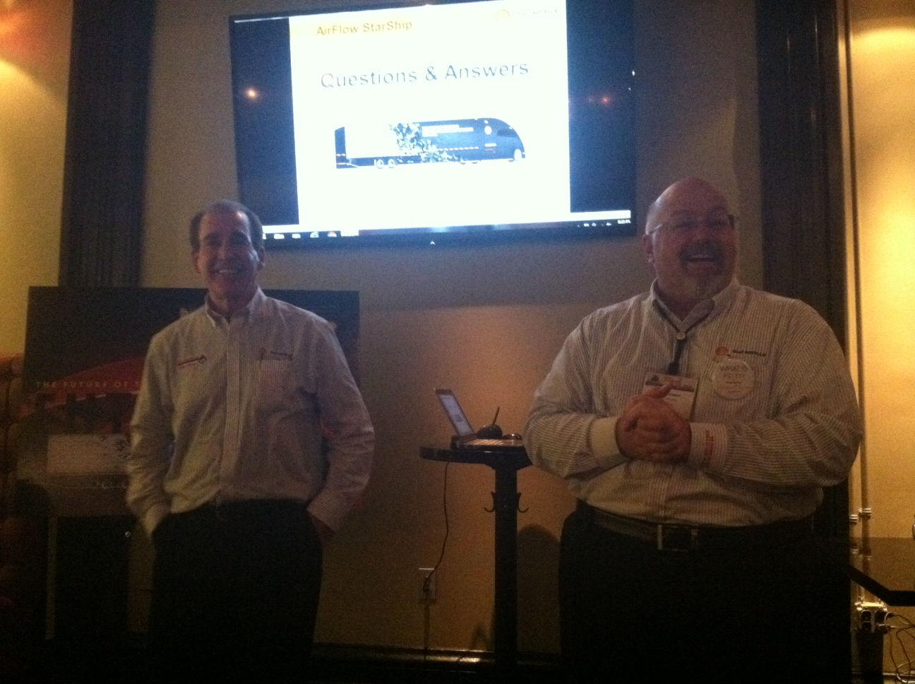 Shell39s Dave Waterman at right and Airflow39s Bob Silwa left discuss the quotStarShipquot tractortrailer concept project being sponsored by Shell Lubricants