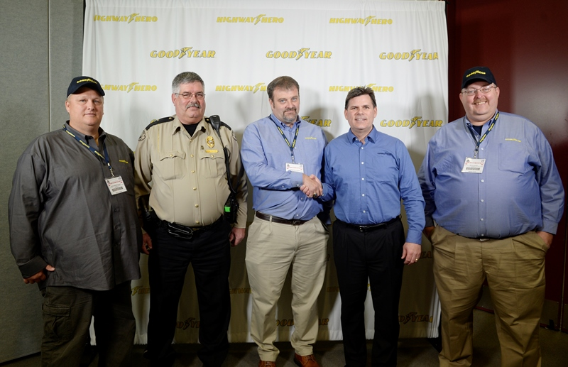 Clinton Blackburn center is congratulated by Gary Medalis marketing director Goodyear Commercial Tire Systems after being named the 2015 Goodyear Highway Hero winner at the MidAmerica Trucking Show in Louisville He is flanked by runners up David Frederickson L and Mack Guffey R along with Spencer County Sherriff Darrell Herndon Blackburn saved the life of Spencer County Sheriff Darrell Herndon who was struggling with a prisoner he was transporting