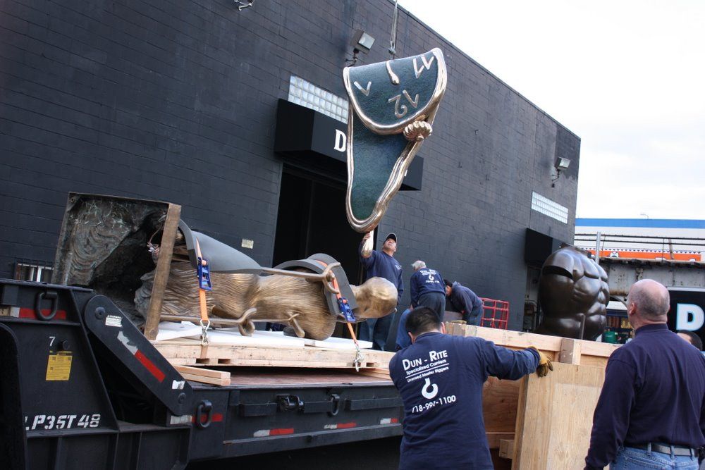 DunRite movers load structures to be installed in the Salvador Dali exhibit at the Time Warner Center in New York