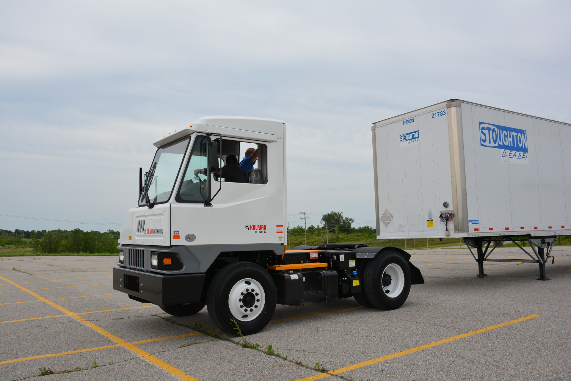 A trucking industry journalist backs up a Kalmar Ottawa T2 terminal tractor into a trailer during the company39s 2015 Ride and Drive event