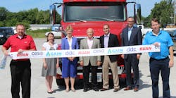 Celebrating the grand opening of a new public CNG station in Des Moines are, from left, Marshall Kraft, Ruan transportation director of operations; Stephanie Weisenbach, Iowa Clean Cities Coalition coordinator; Christine Hensley, Des Moines mayor pro-tem; Ralph Arthur, Ruan president of dedicated contract carriage; Bryan Nudelbacher, U.S. Gain business development manager; Jay Byers, Greater Des Moines Partnership CEO; Steve Larsen, Ruan director of procurement and fuel.