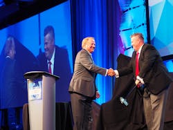 PeopleNet39s Randy Boyles left shakes hands with Curtis Timmer director of IT for Canadian fleet award winner Grimshaw Trucking Photos by Aaron Marsh PeopleNet39s Randy Boyles left shakes hands with Curtis Timmer director of IT for Canadian fleet award winner Grimshaw Trucking Photos by Aaron Marsh