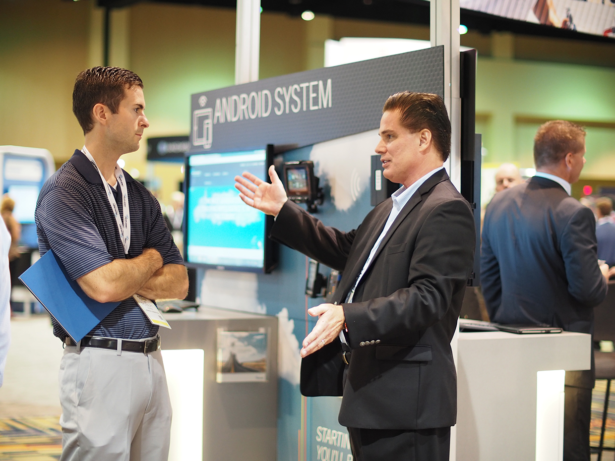 PeopleNet39s Mike Nalepka right speaks with attendee Robert Soper at TMW Systems39 Transforum conference where the two companies announced a new software integration Photo by Aaron Marsh