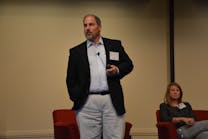 Adam Seidner, global medical director at Travelers, speaks at the insurance company&apos;s Third Annual Transportation Symposium. Erin Mabry, senior research associate at Virginia Tech, also spoke during the event.