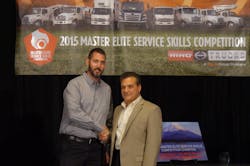 Tom Marchini of Hino Trucks right congratulates Hino Trucks Service Skills Competition champion David Taylor of K Neal left Tom Marchini of Hino Trucks right congratulates Hino Trucks Service Skills Competition champion David Taylor of K Neal left