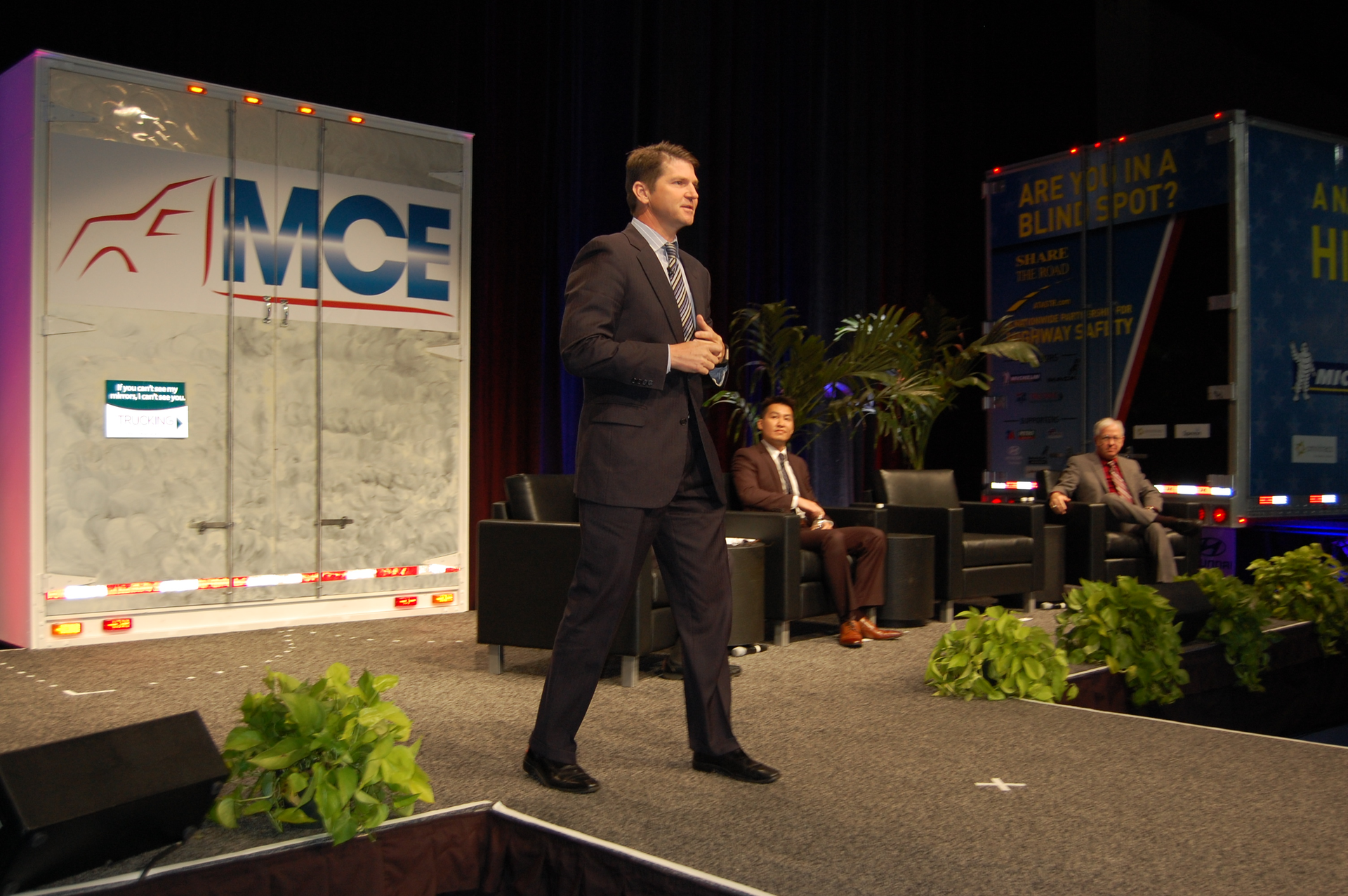 Brian McLaughlin PeopleNet39s president standing offered his take on the future of telematics in trucking Wallace Lau and Paul Menig seated far right offered their take as well