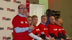 Bradley Jacobs, at left, speaks at a Con-way employee meeting about its $3 billion acquisition by XPO Logistics.