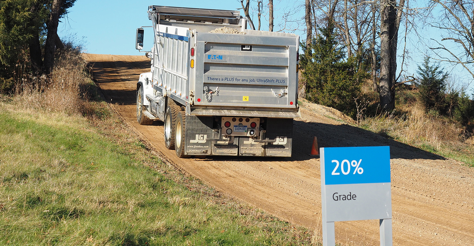 At Eaton39s proving grounds facility in Marshall MI the company showed how its Blended Pedal and Urge to Move features for automated transmissions can allow drivers to make touchy precise lowspeed movements with heavy trucks including this 2013 Western Star dump truck loaded to 63000 lbs seen here inching forward from a stop on a 20 grade Photo by Aaron Marsh