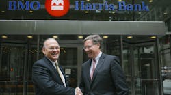 President and CEO of BMO Harris Bank David Casper, right, welcomes Dan Clark, head of BMO Transportation Finance, after the completion of BMO&rsquo;s acquisition of GE Capital Corporation&rsquo;s Transportation Finance business.