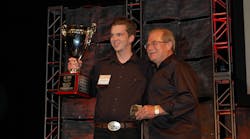 Travis Graham (at left) took home double honors at the 10th annual Rush Truck Centers (RTC) Technician Skills Rodeo. W. M. &apos;Rusty&apos; Rush (on the right), chairman, president and CEO of Rush Enterprises, RTC&apos;s parent company, handed out the awards. (Photo by Sean Kilcarr/Fleet Owner)