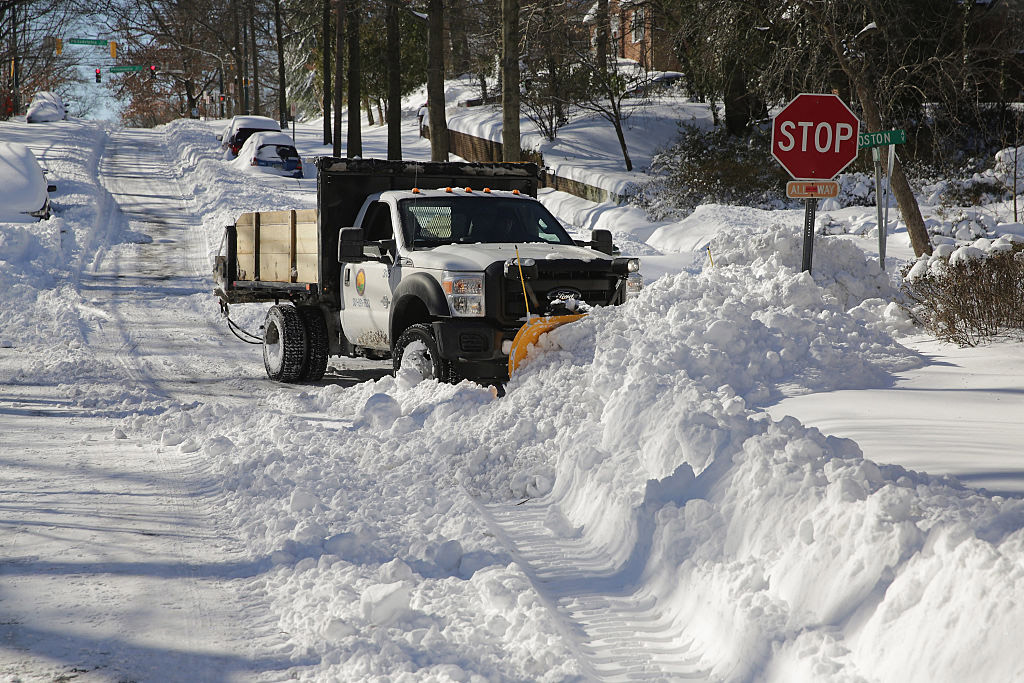 A municipal truck outfitted with a plow attempts to clear an intersection of almost 20 inches of snowfall Jan 24 2016 in Takoma Park MD Blizzard Jonas blanked the East Cost in snow leaving nearrecord snowfall from Arkansas to New York and heavy flooding along the coast The storm dubbed 39Snowzilla39 lasted into early Jan 24 Photo by Chip SomodevillaGetty Images
