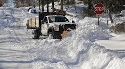 A municipal truck outfitted with a plow attempts to clear an intersection of almost 20 inches of snowfall Jan. 24, 2016 in Takoma Park, MD. Blizzard Jonas blanked the East Cost in snow, leaving near-record snowfall from Arkansas to New York and heavy flooding along the coast. The storm, dubbed &apos;Snowzilla,&apos; lasted into early Jan. 24. (Photo by Chip Somodevilla/Getty Images)