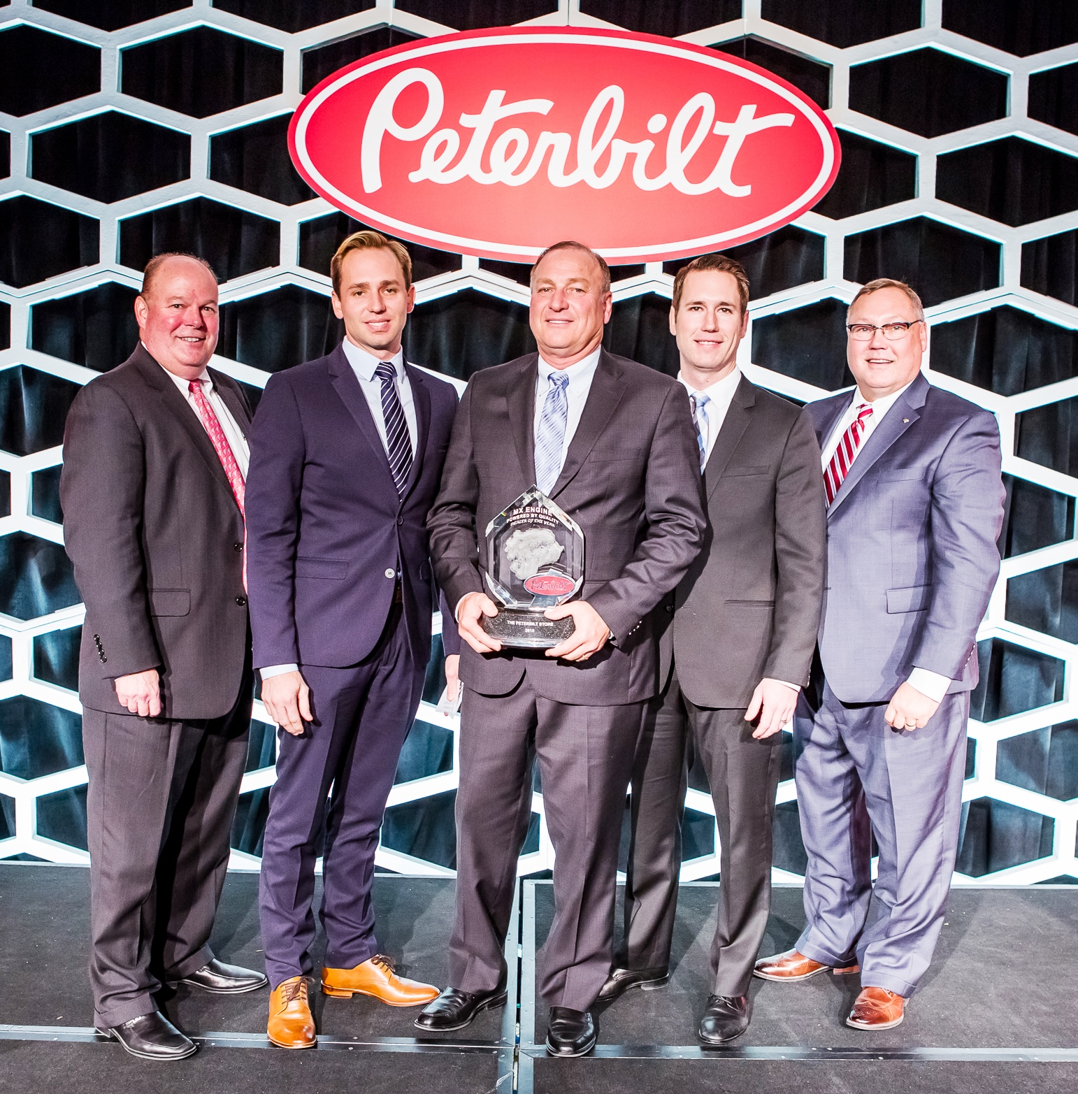 Left to right Peyton Harrell Director of Dealer Network Development The Peterbilt Store Dealer Principals Jeff Arscott John Arscott and Greg Arscott and Robert Woodall Peterbilt Assistant General Manager of Sales and Marketing