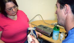 A FusionHealth physician works with a truck driver in the sleep disorder breathing program Mobile teams of FusionHealth doctors test drivers where they sleep and the company gathers data from positive airway pressure PAP devices that drivers use to continually monitor care and adjust if necessary Photo courtesy FusionHealth A FusionHealth physician works with a truck driver in the sleep disorder breathing program Mobile teams of FusionHealth doctors test drivers where they sleep and the company gathers data from positive airway pressure PAP devices that drivers use to continually monitor care and adjust if necessary Photo courtesy FusionHealth