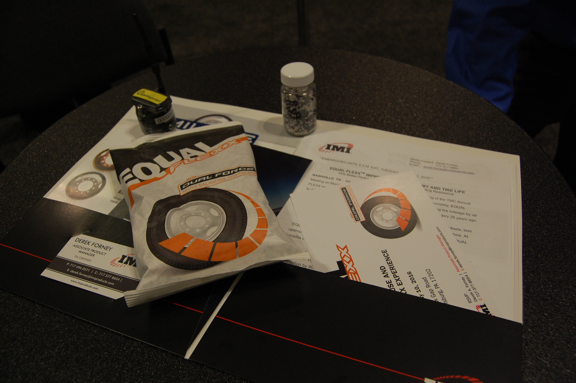 The clear plastic bottle displays the rubber material used inside the Equal Flexx pouch The sensor device to the left of the bottle is one of several IMI uses to monitor vibration levels during fleet testing Photo by Sean KilcarrFleet Owner