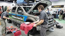 Clock is ticking Stephen Holland right foreground an equipment application engineer at Blossman Services Inc and Stacey Snyder a Blossman conversion technician get started converting the Ford F150 to LPG Clock is ticking Stephen Holland right foreground an equipment application engineer at Blossman Services Inc and Stacey Snyder a Blossman conversion technician get started converting the Ford F150 to LPG