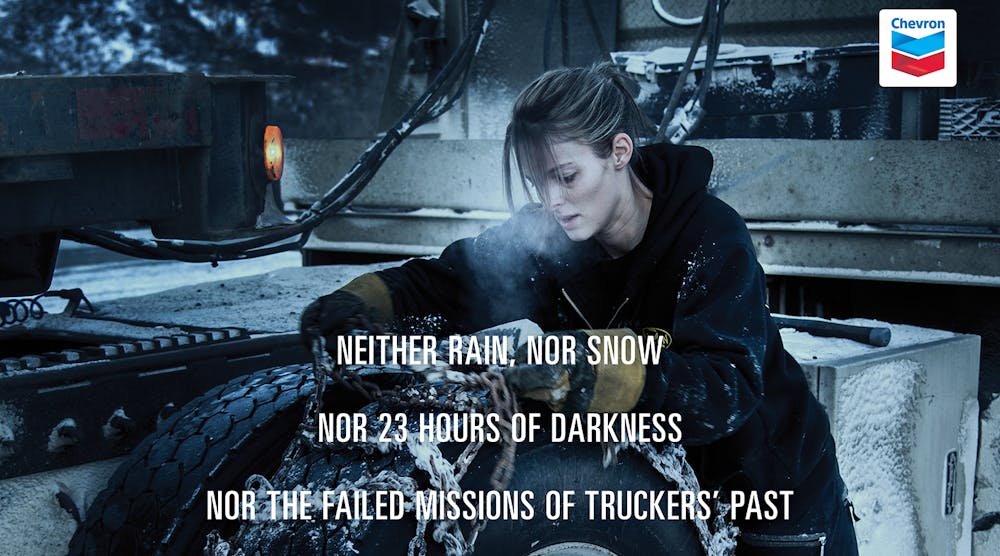 In this crop from a promotional poster for Chevron&apos;s Delo heavy duty motor oil, Ice Road Truckers&apos; Lisa Kelly makes a pledge based on what&apos;s popularly known as the Postman&apos;s Creed: &apos;Neither rain, nor snow, nor 23 hours of darkness, nor the failed missions of truckers past, nor acts of God shall stay me and these chained-up wheels from reaching the final outposts of this vast frontier.&apos;