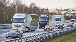 Daimler&apos;s Highway Pilot Connect platoons three trucks on a public highway in Germany. Second and third trucks are operating semi-autonomously with steering, acceleration and braking controlled by the lead vehicle.