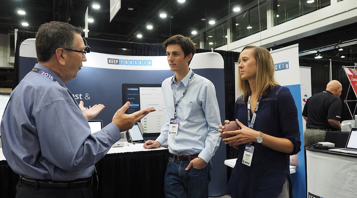 An attendee talks ELDs with Jon Sockell, center, director of marketing at KeepTruckin, and company sales rep Kady Pooler at the National Private Truck Council&apos;s (NPTC) 2016 Annual Conference.