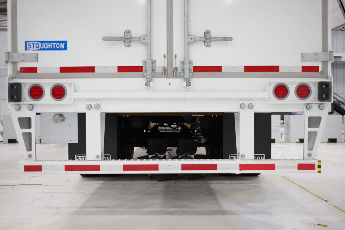 The new rear underride guard design includes two additional bolton vertical supports on the outer ends of the horizontal bar Photo courtesy of Stoughton Trailers