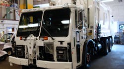 A new Mack LR is prepped for duty as an NYC refuse collection truck ready to do double duty as a snow plow when needed.
