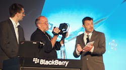 &apos;White hat&apos; hackers Campbell Murray, at right, and Fraser Winterborn, far left, demonstrate at the BlackBerry Security Summit how engineering flaws and lack of forethought in IoT devices can essentially give cybercriminals a back door into a secure wireless network &mdash; and possibly allow them to leave no detectable trace they were ever there.