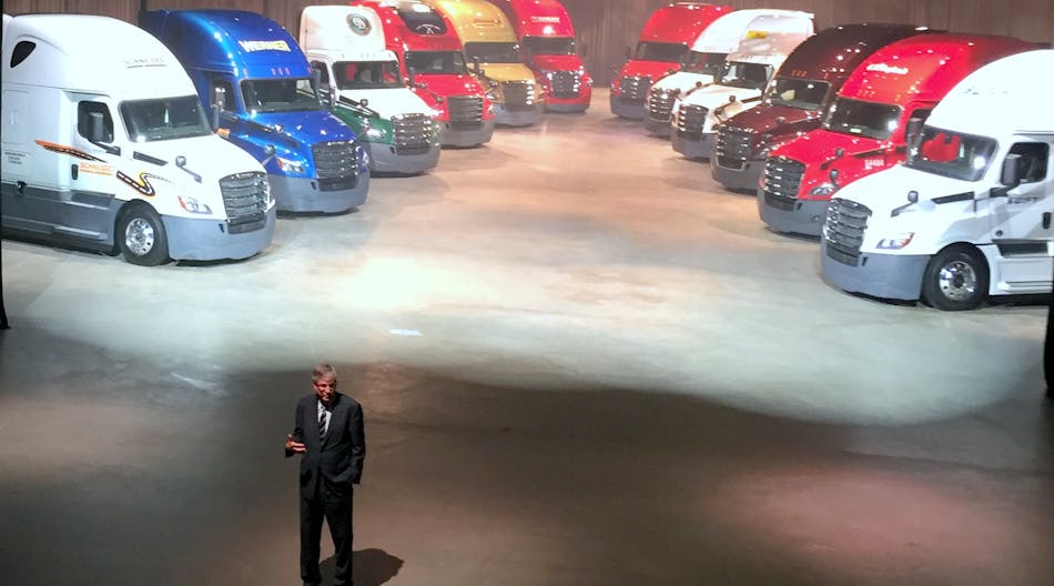 DTNA president and CEO Martin Daum unveils 12 next-gen 2018 Freightliner Cascadia being delivered to the company&apos;s 12 largest fleet customers.