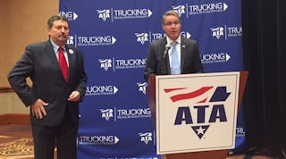 Kevin Burch (at left) is ATA&apos;s incoming chairman. At right, standing at the podium, is Chris Spear, ATA&apos;s new president and CEO. (Photo by Sean Kilcarr/Fleet Owner)