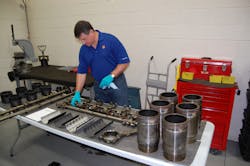 Shell39s Dan Arcy examining engine components following teardown testing conducted two years ago as part of the company39s PC11 development process Photo by Sean KilcarrFleet Owner Shell39s Dan Arcy examining engine components following teardown testing conducted two years ago as part of the company39s PC11 development process Photo by Sean KilcarrFleet Owner