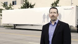 Scott Cornell a transportation crime and theft specialist at the Travelers Companies stands near the disguised Travelers Sting Trailer Scott Cornell a transportation crime and theft specialist at the Travelers Companies stands near the disguised Travelers Sting Trailer