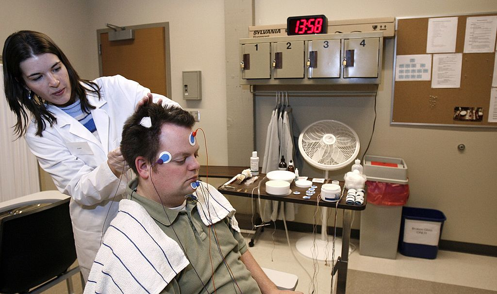 Lab technician Amy Bender places wires on the head of Ryan Gamble in preparation for a polysomnographic recording system demonstration at Washington State University Spokane39s Sleep and Performance Research Center December 13 2006 in Spokane WA A driver for Crete Carrier was fired for refusing the carrier39s request to submit to a sleep study due to a high BMI A US Court of Appeals has ruled in favor of the carrier
