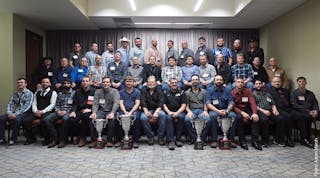 If you&apos;ve made it to this room, it&apos;s safe to say you&apos;re a very skilled truck tech. The winners of the 2016 Rush Truck Centers Tech Skills Rodeo pose together with company CEO W.M. Rusty Rush and winning NASCAR driver Tony Stewart (at left and right-center in front row, respectively) Dec. 13, 2016, in San Antonio.