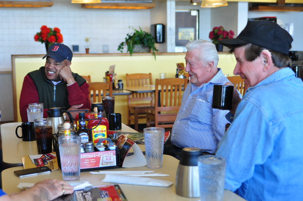 FMCSA Administrator Scott Darling at a truck stop with Jim Johnston middle president of the OwnerOperators Independent Drivers Association and truck driver Leo Wilkins right