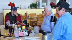 FMCSA Administrator Scott Darling at a truck stop with Jim Johnston middle president of the OwnerOperators Independent Drivers Association and truck driver Leo Wilkins right