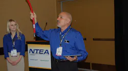 Exotic39s Henry Testa shows off Parker Hannifin39s new low permeation natural gas fuel hose Photo by Sean Kilcarr for Fleet Owner