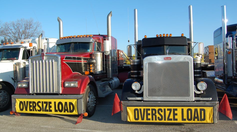 A truck and trailer weighing more than 80,000 lbs. or having a width of more than 102 in. would meet the federal definition of oversize/overweight freight. (Photo by Sean Kilcarr for Fleet Owner)