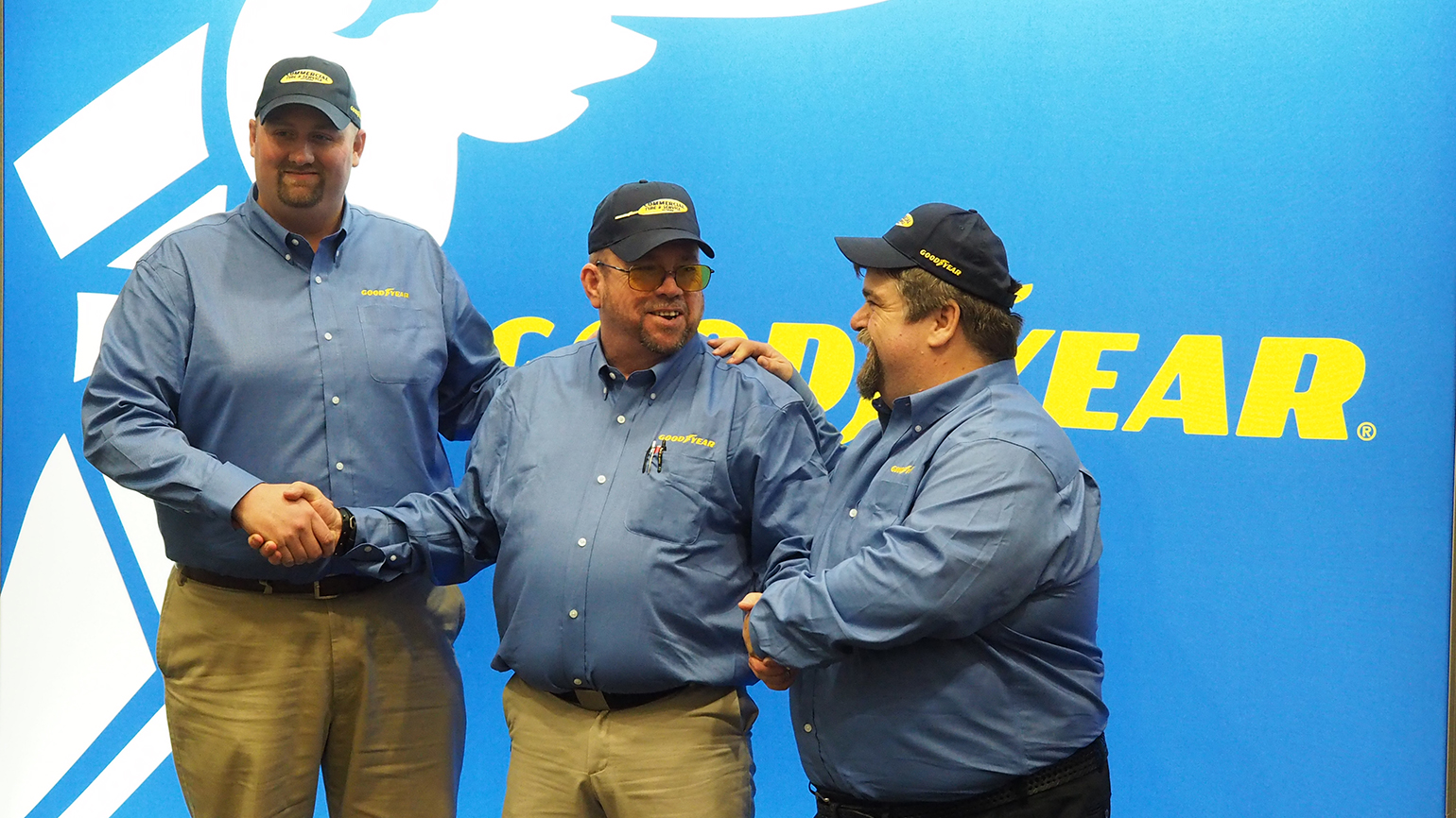 David Webb center winner of this year39s Goodyear Highway Hero award shares the spotlight with fellow truck driver finalists Chris Baker right and Tim Freiburger